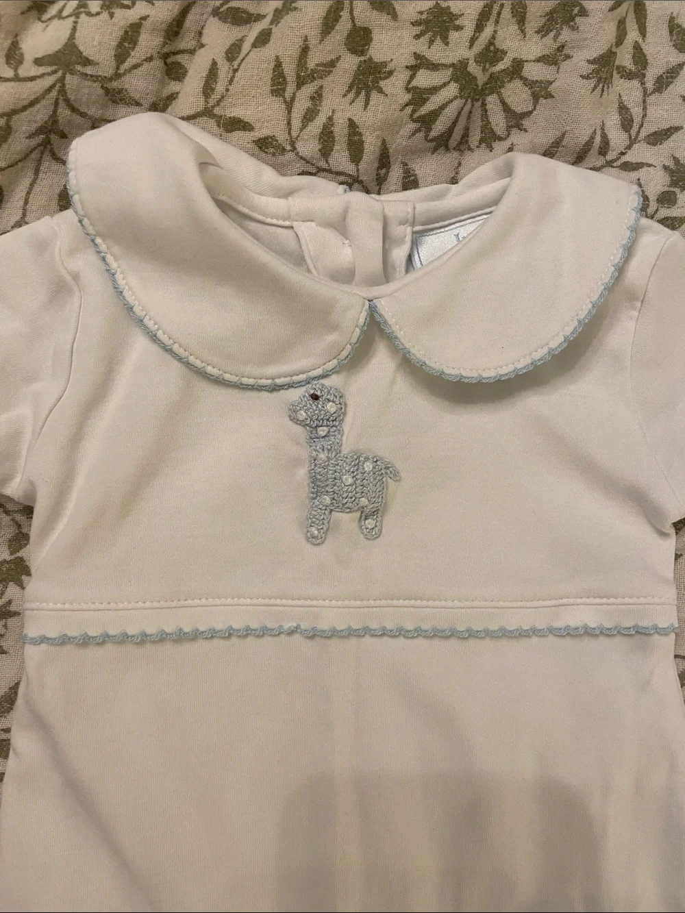 Playsuit with light blue crocheted giraffe